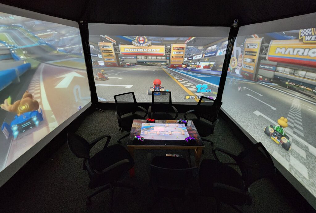 Up to 4 players can play at once on the giant wall screens